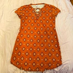 Orange T-shirt with chest design and pattern